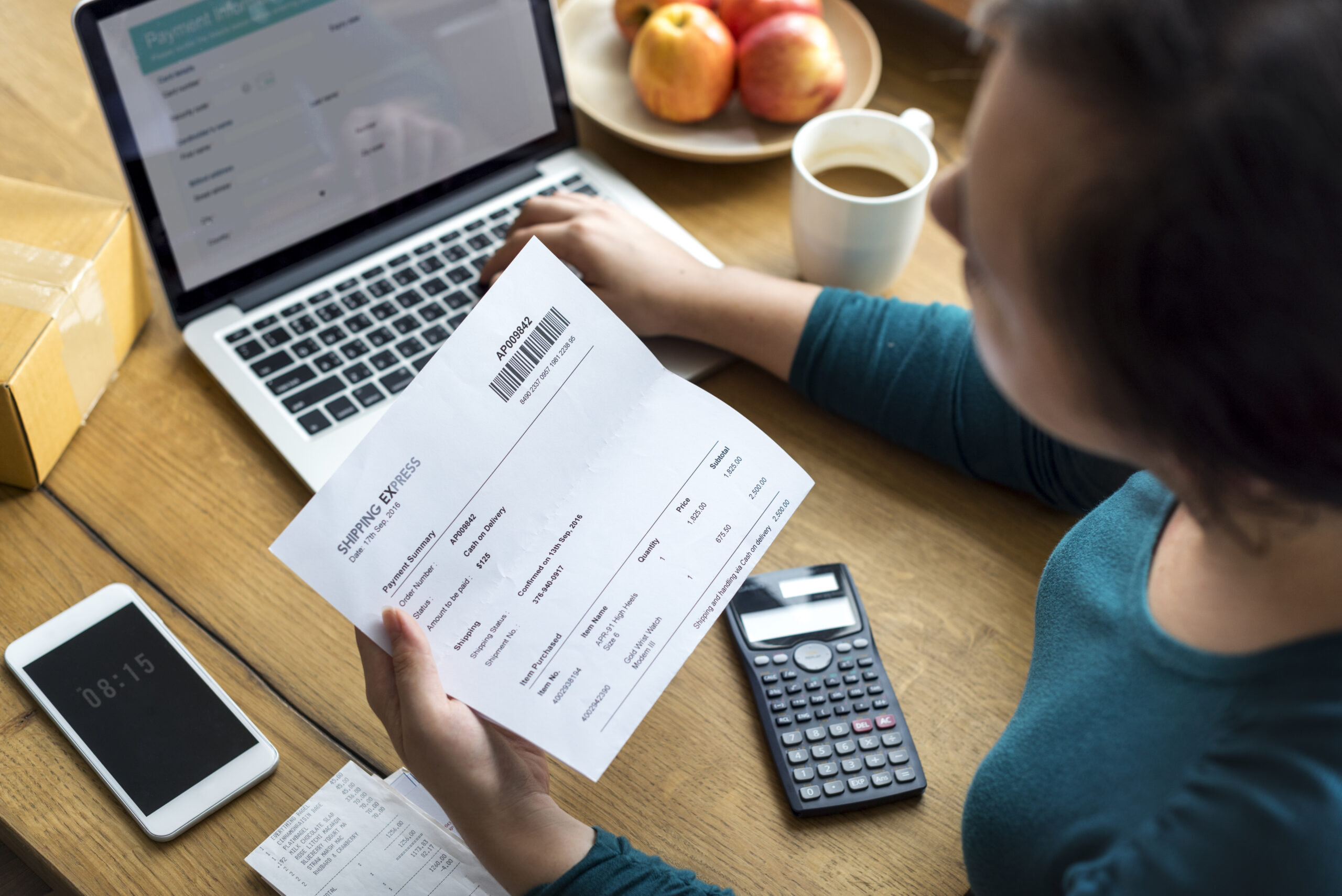 Woman checking shipping letter